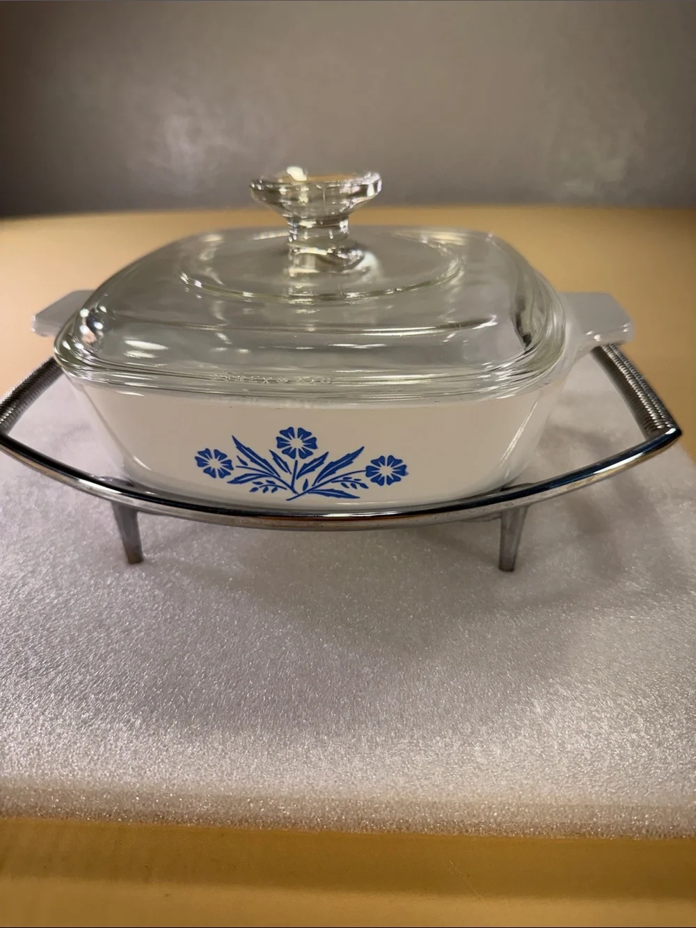 Corning, ware casserole, dish, glass lid, and chrome trivet